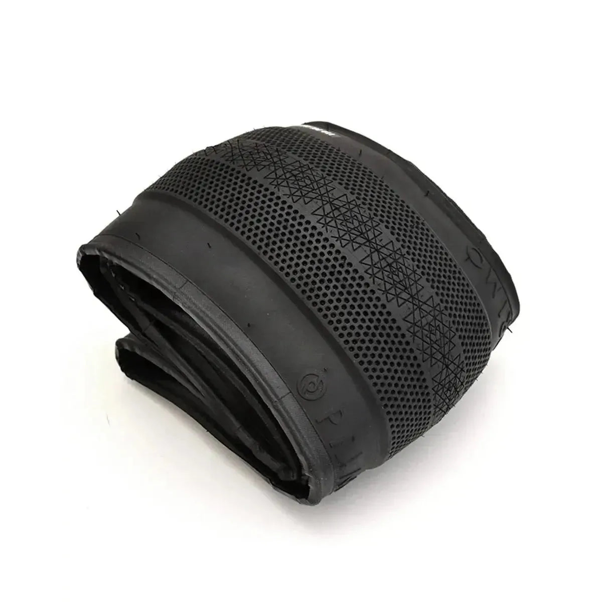 A Primo Richter 20 Inch Folding Tyre in black, sized 20x2.4 with a patterned tread and smooth sidewalls, is displayed on a white background, showcasing its lightweight folding tire design.