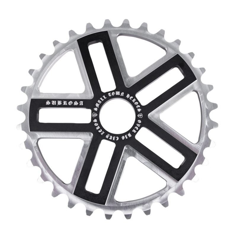 The Subrosa Hero Sprocket is a silver and black metal sprocket featuring five wide arms and engraved text around the center, making it a stylish accessory for your bike.