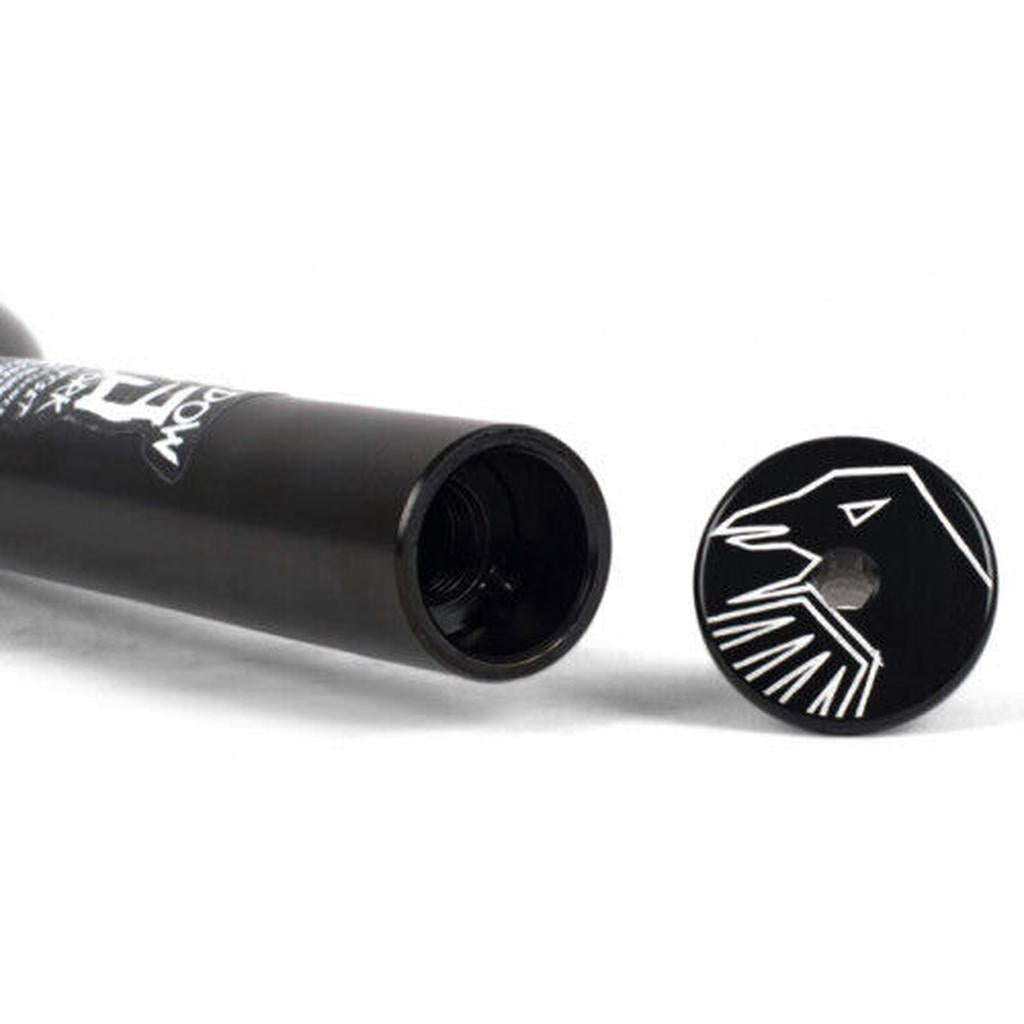 The Shadow Conspiracy 13 Fork is a black chromoly cylindrical BMX fork with a 13mm offset, an open end, and a separate cap featuring a stylized white bird head design.