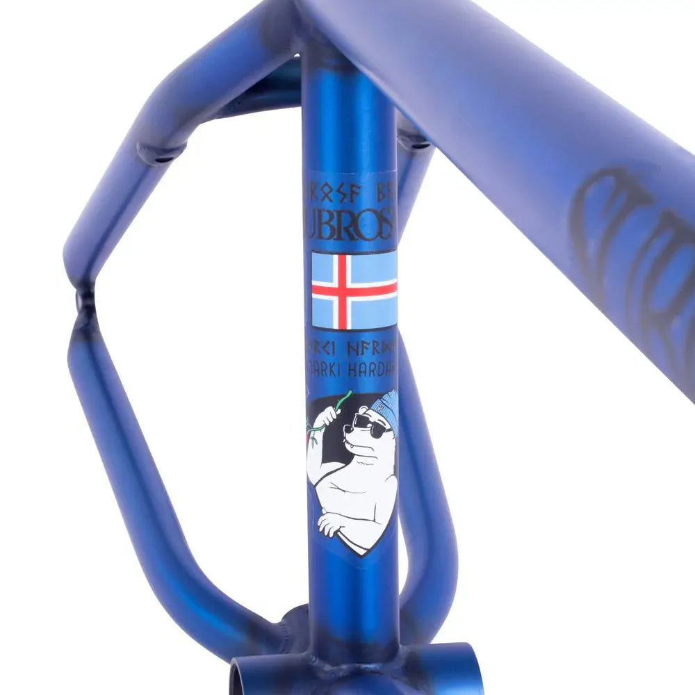 Close-up of the Subrosa MRIII Frame (Bjarki Hardarson Colorway) in blue chromoly, featuring a cartoon polar bear, Scandinavian flag, and unique graphics on the head tube.