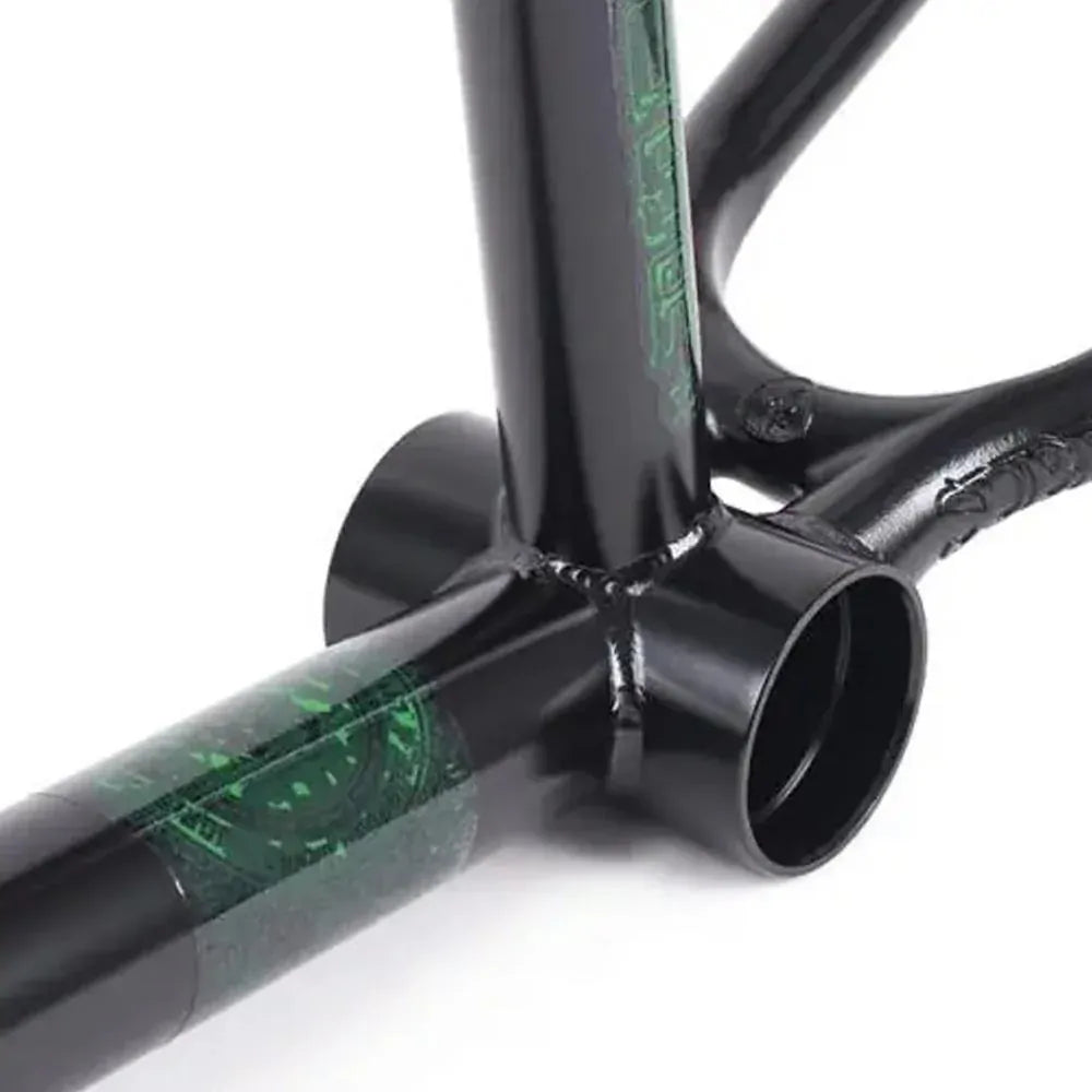 Close-up of a Subrosa OM V2 Frame, highlighting the bottom bracket area with visible welds and green decals, part of the Joris Coulomb signature series.