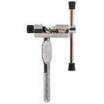 The Rant Break Em Chain Tool is a silver metal tool with a textured handle and crossbar, designed for compressing and rolling cones, similar to a bike chain breaker for precise adjustments.