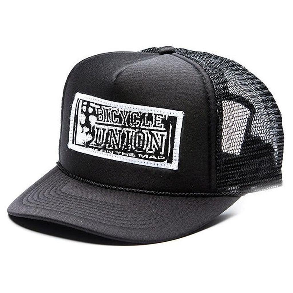 The Bicycle Union Patch Trucker Hat is a black mesh cap with a white front patch reading "Bicycle Union"—the ideal BU accessory for any nog.