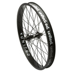 A black United Supreme front wheel with visible spokes and branding on the double-walled rim.