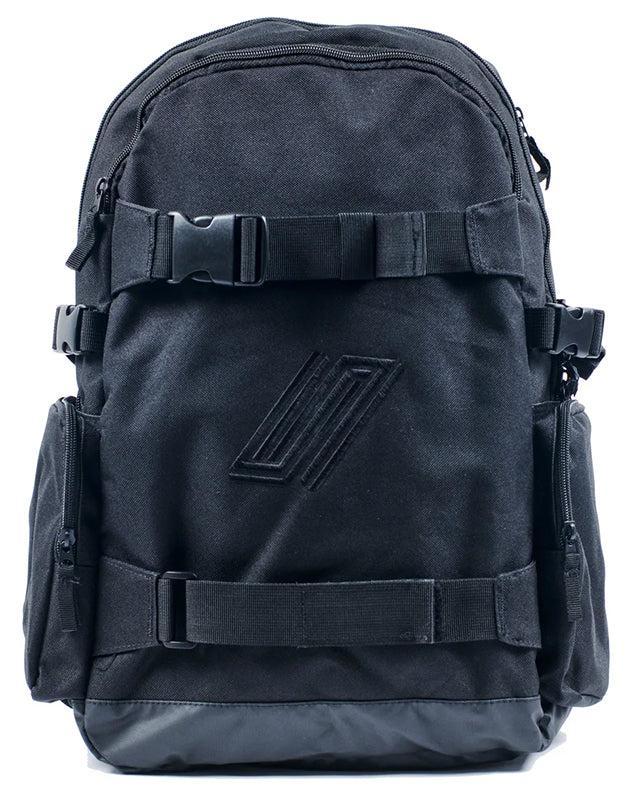 The United Dayward Backpack showcases a black design with two front buckles, side pockets, a subtle geometric logo, and skateboard carry straps, all set against a white background.