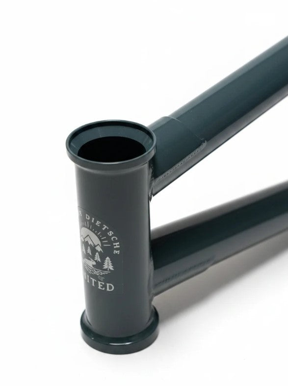 Close-up of the United Pro Model Frame (Marius Dietsche Signature) in dark green, highlighting a silver head tube logo, precise weld joints, and sections of the top and down tubes crafted from 4130 Sanko Japanese tubing.