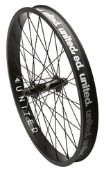 A black United Supreme front wheel with visible spokes and branding on the double-walled rim.
