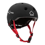 The PROTEC - JR CLASSIC FIT CERTIFIED helmet is black with ventilation holes, gray EPS foam padding for a custom fit, and red adjustable chin straps with a black buckle, shown against a white background.
