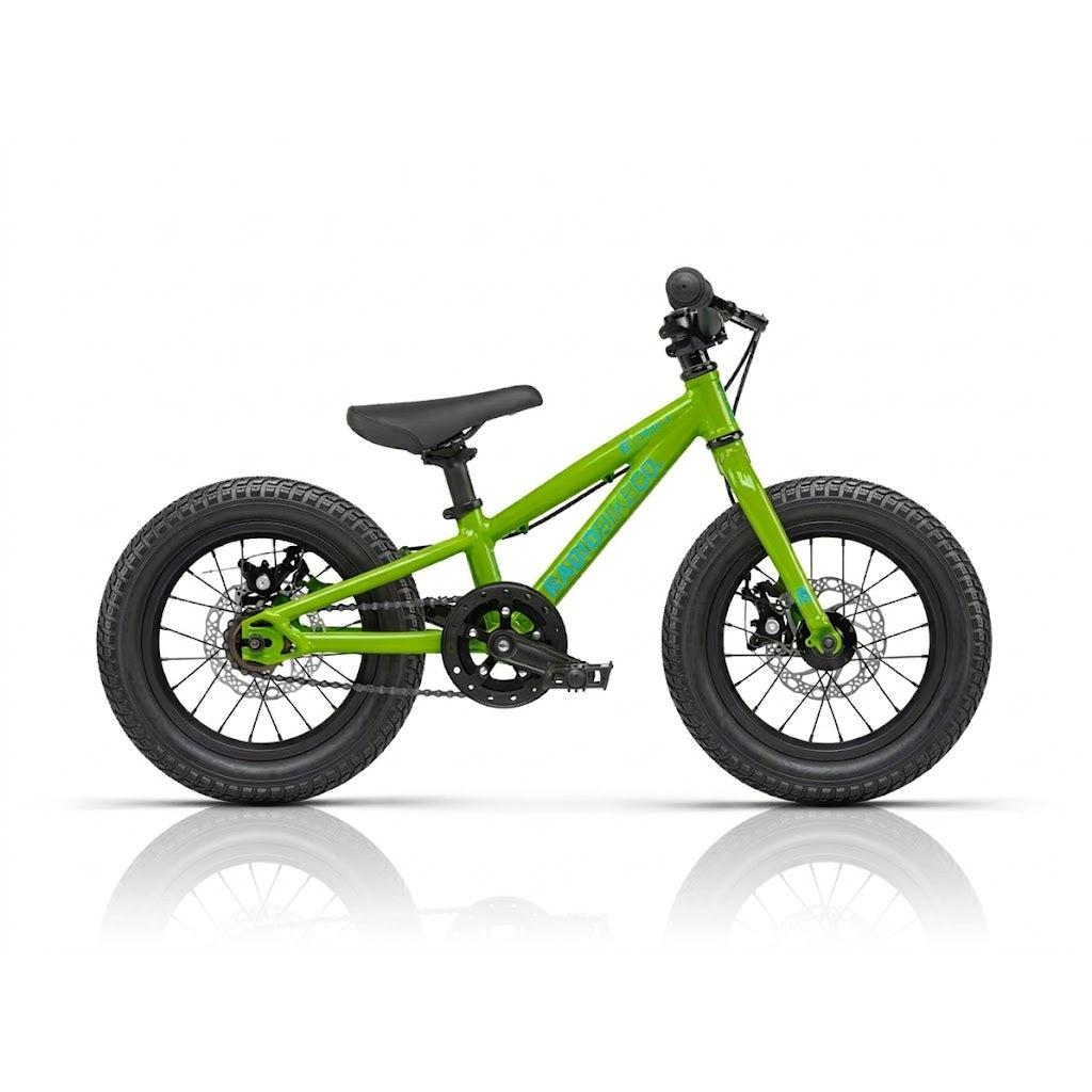 The Radio Zuma 14 Inch Bike is a small green kids’ bike with thick black tires, a black seat, and pedals, displayed on a white background.