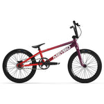 The Meybo 2025 Clipper Pro XXL BMX race bike features a gradient red to purple frame, black handlebars, seat, and wheels, along with a visible chain and pedals. Designed for speed and style on the track.
