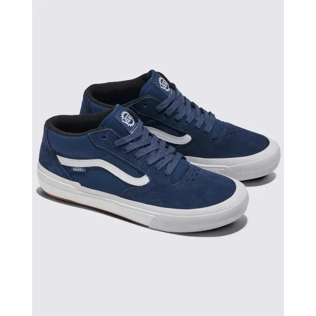 The Vans BMX Style 114 in navy/white features white waffle cup soles and the iconic white side stripe, offering excellent ankle support for casual wear and cycling enthusiasts.