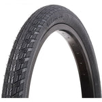 Close-up of a black Vee 20 x 1.75in Speed Booster Foldable Tyre, featuring a textured tread pattern designed to minimize rolling resistance. The sidewall prominently displays the tire model information, making it your ultimate speed enhancer on the track.