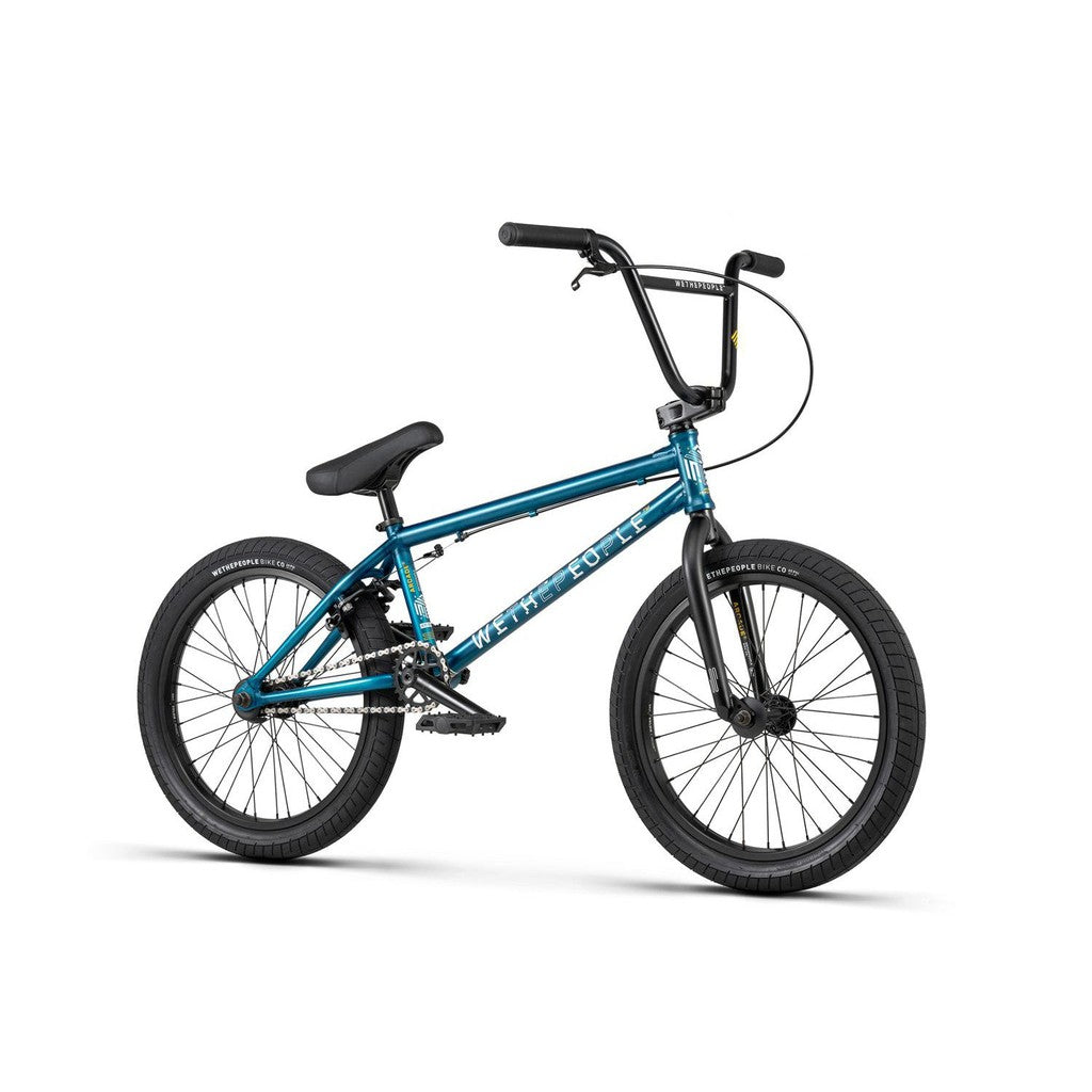 The Wethepeople Arcade 20 Inch Bike is a blue mid-tier BMX with Salt Comp black handlebars, seat, and tires, shown on a white background.