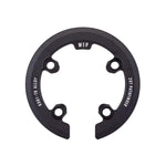 The Wethepeople Pathfinder Sprocket Guard (28T) is a black, circular 6061-T6 alloy guard with three bolt holes and a partial cutout, providing durable protection for your Pathfinder sprocket.