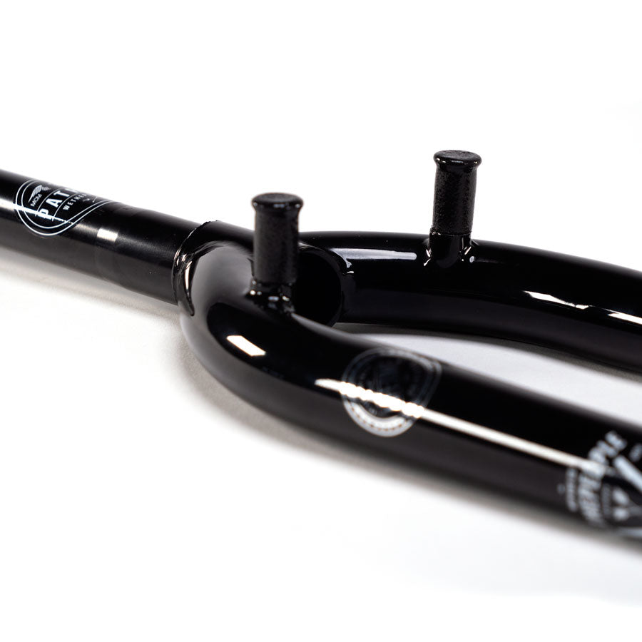 A black Wethepeople Patron 25 Forks w/Mounts with a logo on it, designed for riders.