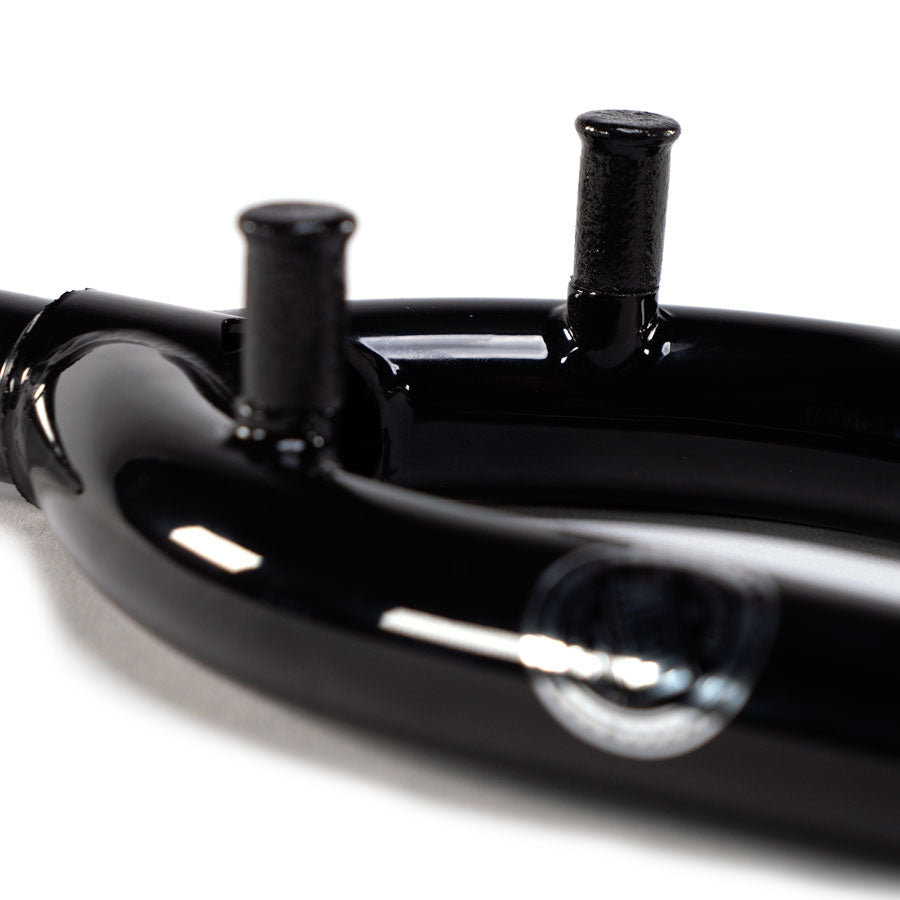 A close up of Wethepeople Patron 25 Forks with Mounts, a black bicycle handlebar with front brake mounts.