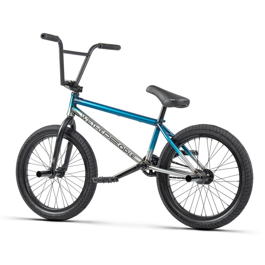 A Wethepeople Reason 20 Inch BMX Bike riding through urban warriors on a white background.