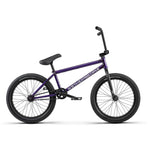 The sleek Purple BMX bike boasts a chromoly frame with black handlebars, seat, and wheels. The frame showcases the "Wethepeople" brand and features hybrid equipment.
