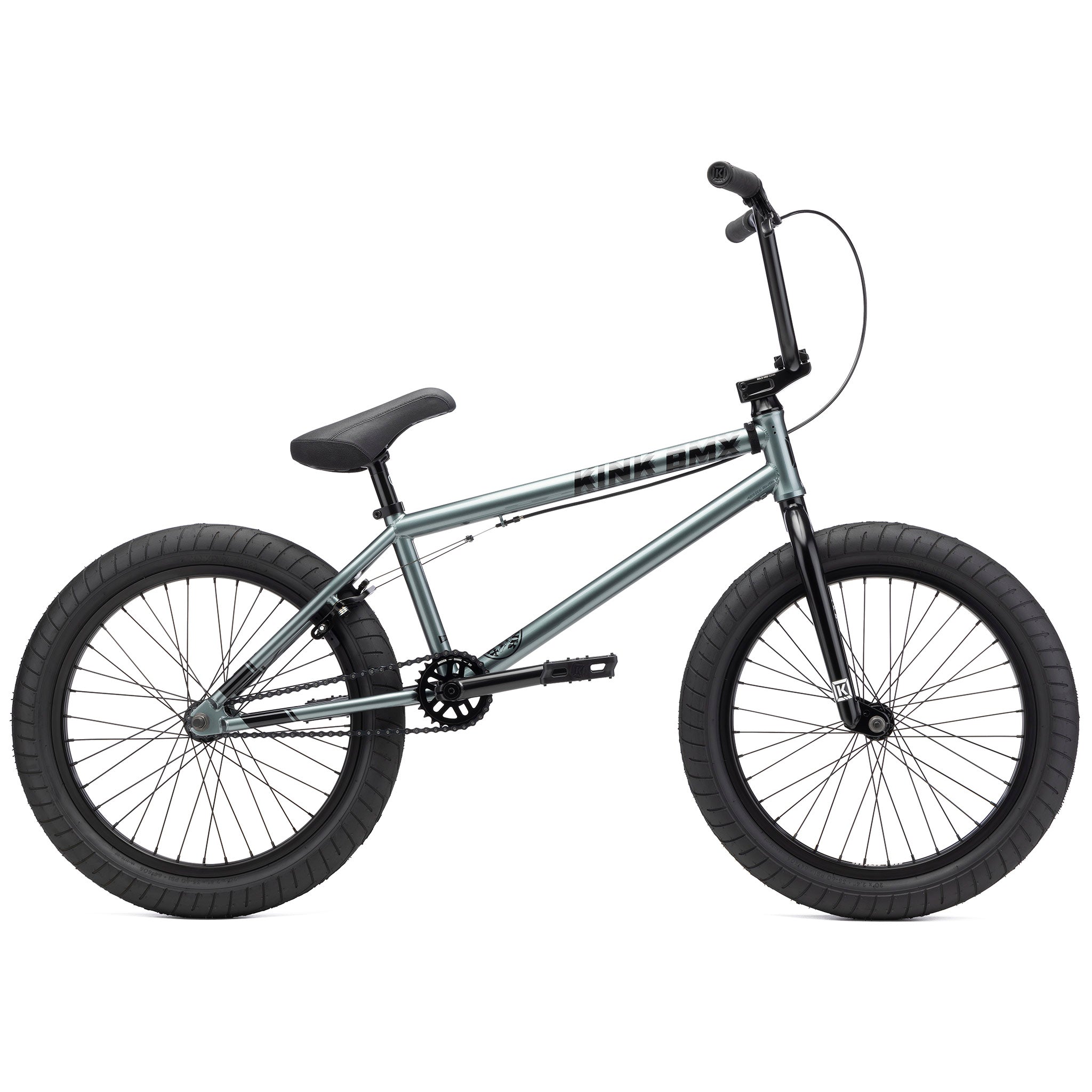 A grey Kink Whip 20 Inch Bike with thick tires, a black seat, and handlebars features a robust Chromoly frame and sealed bearings, shown in a side profile view against a white background.