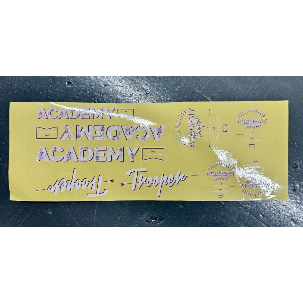 A rectangular Academy Trooper Sticker Pack sheet featuring various logo decals in different sizes, fonts, and orientations, ideal for replacement stickers.
