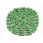 A coiled green bicycle chain with colored outer plates, arranged in a circular pattern, exemplifies the craftsmanship of the YBN Freestyle chain 1/2-1/8 single-speed design.