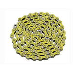 The YBN Freestyle chain 1/2-1/8 is elegantly coiled against a white background, showcasing its yellow links with black pins and silver inner links, accented by colored outer plates. Proudly crafted by YBN Chains, this single speed bicycle chain is notable for its vibrant design and reliable performance.