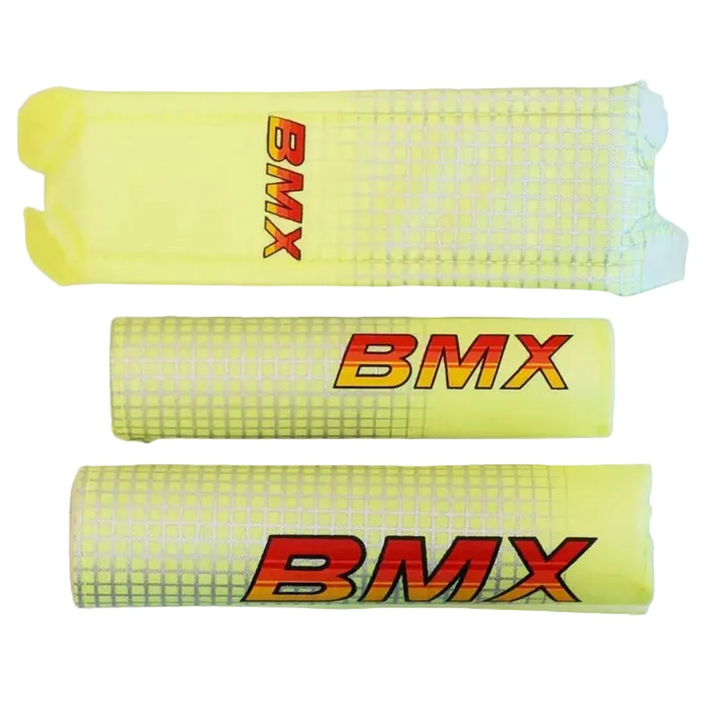 The BMX Crash Pad Set includes three yellow foam pads with a white grid pattern and "BMX" in red and orange. Designed to protect your handlebar and frame, they come in different sizes and colors for personalized safety.