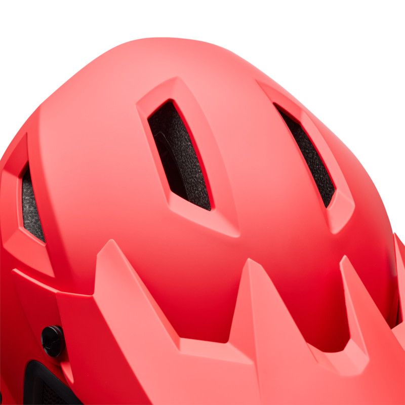Close-up of the Bell Sanction 2 Red, an entry-level helmet for young riders, featuring three ventilation slots and angular design details.